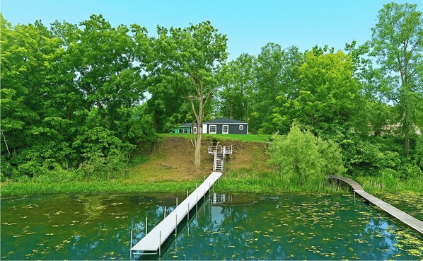 Private dock leads right to your lakeside retreat—seamless access for paddling or relaxing in the view.