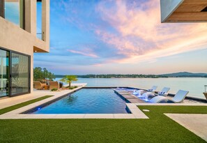 Soak in the sunset with lake views, in-water loungers, and a sleek modern pool. Relaxation has never looked this good.