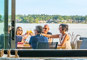 Golden hour sips, lakeside laughs. The only thing better than the view is the wine.