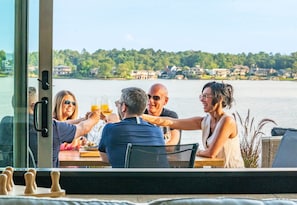 Golden hour sips, lakeside laughs. The only thing better than the view is the wine.