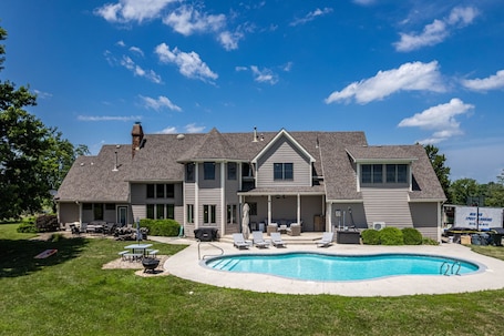 Back of home, facing pool and fishing pod + tons of trees!