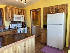 Your full kitchen with copper and granite countertops.