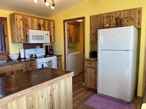 Your full kitchen with copper and granite countertops.