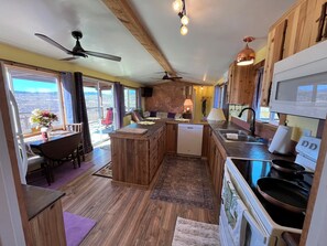 A full kitchen with all appliances including washer and dryer