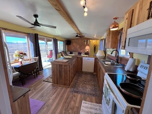 A full kitchen with all appliances including washer and dryer