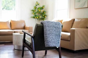 Thoughtfully designed with soft textures and natural light for easy lounging.