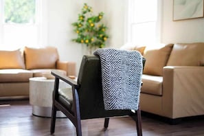 Thoughtfully designed with soft textures and natural light for easy lounging.
