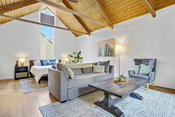 Seamless open-plan studio featuring a king bed and an inviting sofa