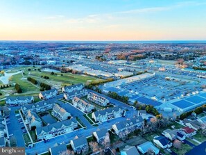 aerial view of neighborhood and golf course