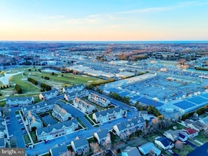 aerial view of neighborhood and golf course