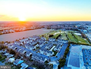 aerial view of neighborhood and golf course