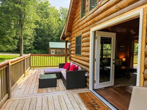 Seamless indoor-outdoor living - enjoy coffee on the wraparound deck, then head inside to the sun-filled great room with soaring ceilings and open layout.