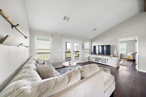 Curl up with a good book in the inviting living room
