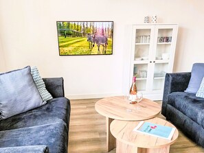 Furniture, Interior Design, Floor, Flooring, Couch, Living Room, Room, Wood, Cushion, Throw Pillow
