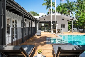 Soak up the sun on stylish poolside lounges, with the magnesium pool at your feet and direct access to guest suites and the shaded pavilion—perfect for relaxing or entertaining in comfort.