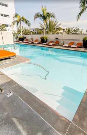 Resort-style pool with lounge seating for sun-soaked afternoons