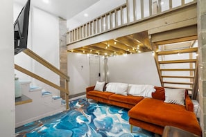 Living room with smart tv and couch (1)