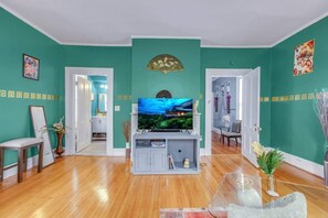 Original hardwood floors and a stately fireplace add warmth and character to this beautifully remodeled space.
