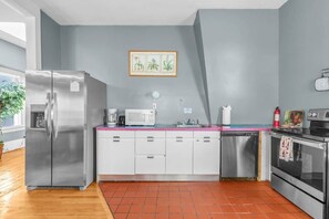 Fully-stocked kitchen with modern appliances and a cozy dining nook.