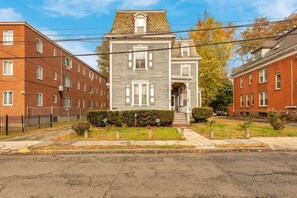 Charming exterior view of the property with a welcoming entrance and surrounding greenery.