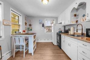 Fully equipped cozy kitchen.