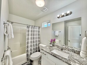 The full bathroom upstairs can be accessed from either Bedroom 1 or the hallway