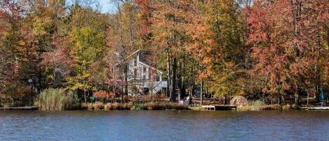 Our Lakefront Home – here’s our cozy home from across the water. Enjoy direct lakefront access with our private dock – take out our kayaks or boat to enjoy the water!
