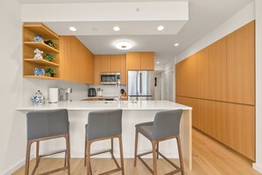 A fully equipped kitchen is ready for your culinary creations.