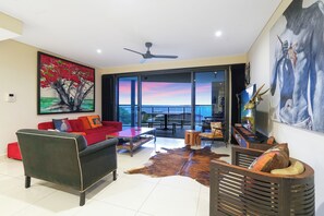Comfortable living and lounge, step straight out onto the large balcony.