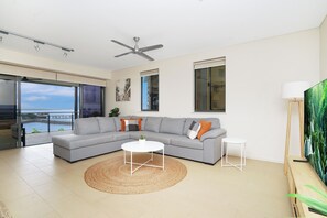 Large modular sofa, spacious lounge area that steps straight out onto balcony.