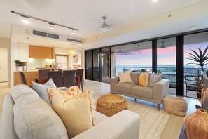 Lounge area that opens onto balcony.