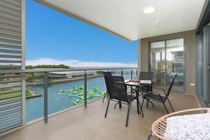 Access from the main bedroom onto the balcony via separate sliding glass doors.