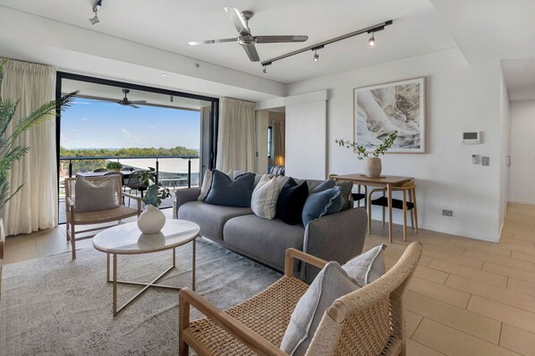 Lounge, two piece dining setting, all open plan to step out onto the balcony.