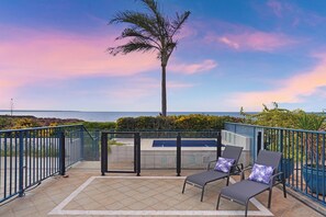 Small plunge pool and outdoor day beds.