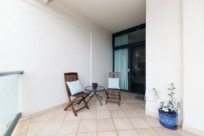 Large balcony making use of the seated nook, great for a chill drink or book.
