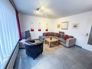Furniture, Interior Design, Flooring, Floor, Couch, Ceiling, Room, Living Room, Lighting, Apartment