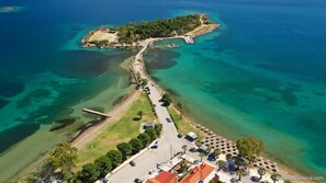 Pezonisi Beach – Stunning turquoise bay with easy access and a scenic walkway leading to the island.