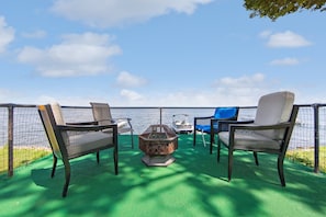 Unwind by the firepit with stunning Oneida Lake views—perfect for stargazing!