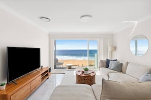 Lounge on the L-shaped sofa and unwind with a movie on the TV in the living room—all while the waves provide the perfect soundtrack to your stay.