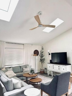 Unwind in this bright, open living room with ample seating designed for comfort.