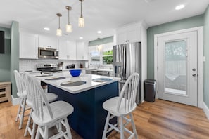 Eat-in Kitchen and access to the back deck for grilling & dining