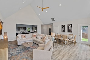 Large Living room with sectional, TV, lake views!
