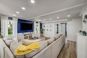 Let's sit and relax while enjoying our smart TV.