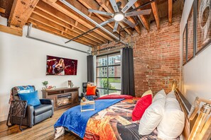 Primary living area featuring a King bed, smart TV, and cozy furnishings.