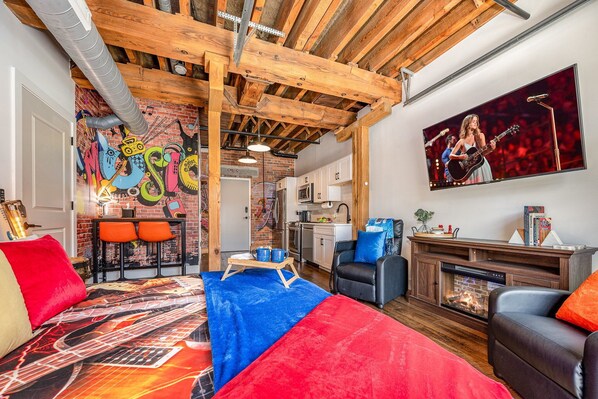 Primary living area featuring a King bed, smart TV, and cozy furnishings.