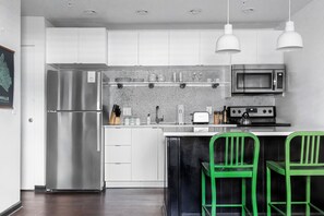 Full kitchen stocked with essentials.