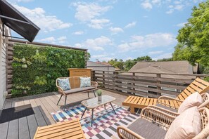 Huge private patio with plenty of seating + sun loungers, perfect for a relaxing afternoon or enjoying your morning coffee in this peaceful, family-oriented neighborhood.