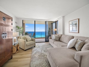 Relax in the spacious oceanfront living room with plush seating and direct access to a private lanai overlooking the turquoise waters of West Maui.