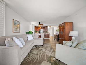This open-layout condo blends tropical design with comfort, featuring a full kitchen, cozy living room, and sweeping ocean views in every direction.