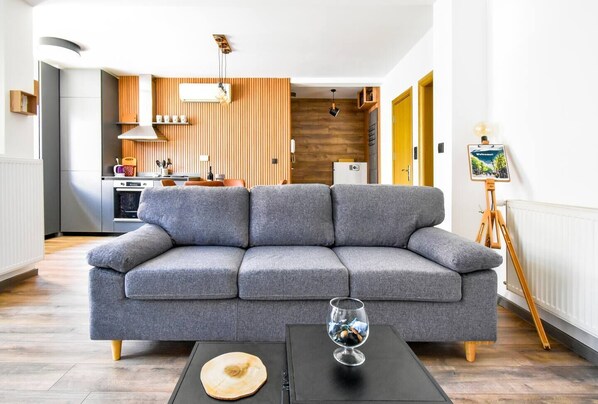 Lounge in Scandinavian comfort—perfect for movie nights, morning coffee, or a midday recharge